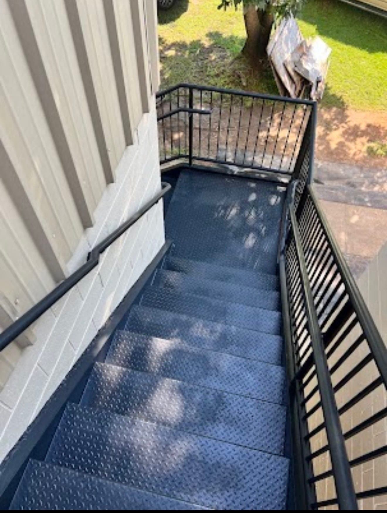 Same staircase after a clean satin-black repaint